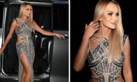 Amanda Holden glows in a daring thigh-high slit dress
