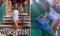 Amanda Holden looks stunning in a white wetsuit in Dubai as she braves an enormous water slide