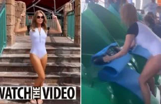 Amanda Holden looks stunning in a white wetsuit in Dubai as she braves an enormous water slide